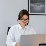 Small business entrepreneur using AI tools on a laptop to automate daily operations