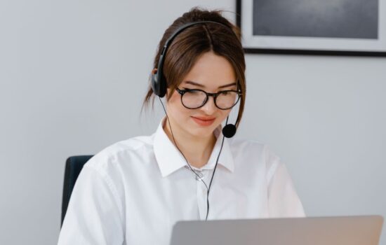 Small business entrepreneur using AI tools on a laptop to automate daily operations